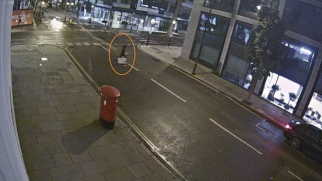 Moment brazen thief breaks into London gallery to steal £270,000 Banksy artwork…before casually strolling down the road with it tucked by his side